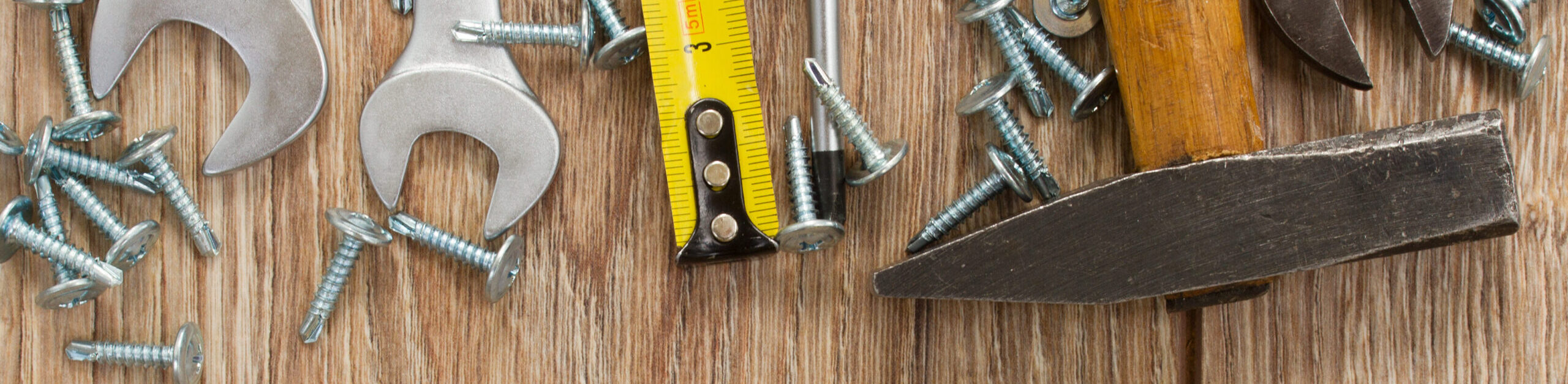 tools kit border on wooden  parquet planks